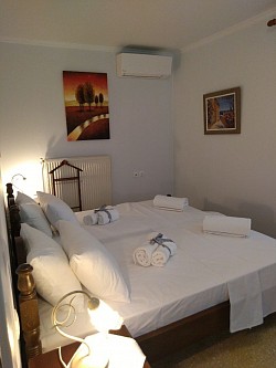 Bedroom with two wood beds transformed in one big bed. . We use only linen sheets for your bed.