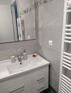 Spacious comfortable bathroom with necessary accessories