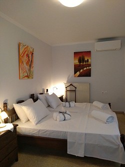 Bed room wit two wood beds easy transformed in one king bed